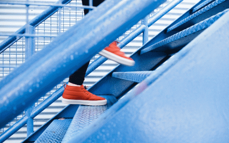 Stepping Person with orange shoes walking up stairs - Image by Free-Photos from Pixabay