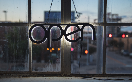 Open Sign in window with orange lights - Photo by Luke Southern on Unsplash