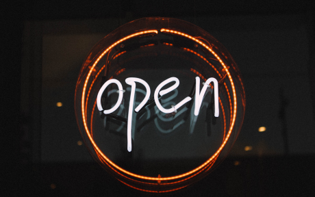 Neon Sign with the word open in an orange circle - Image by Pexels from Pixabay