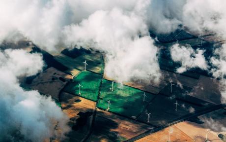 Wind farm aerial view with clouds and fields – Photo by Thomas Richter on Unsplash